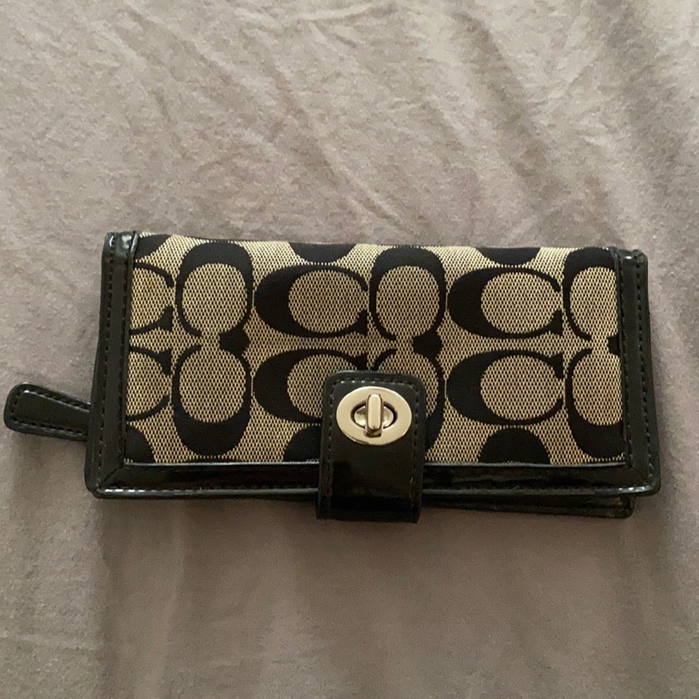 Coach bifold wallet with twist lock